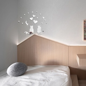 Detail of 3D acrylic mirror wall stickers featuring cats and stars in a modern bedroom