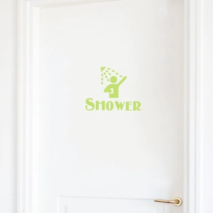 Luminous green shower door sticker with silhouette icon and shower text on white door