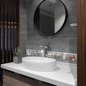 Detailed view of silver hollow geometric acrylic mirror wall stickers in a bathroom set