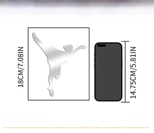 Size comparison of silver ballet dancer mirror wall sticker measuring 18cm next to a phone