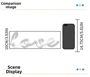 Size comparison of silver acrylic mirror love wall sticker with mobile phone dimensions
