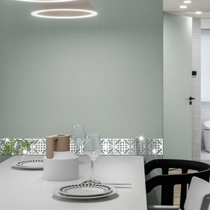 Macro detail of silver mirror acrylic wall stickers with geometric cutout waistline pattern