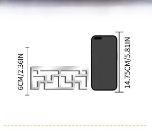 Size comparison of 6cm silver mirror wall sticker next to a smartphone for scale