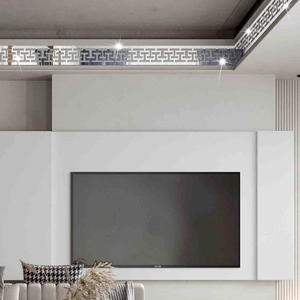 Close-up of Greek Key silver mirror wall sticker on modern living room ceiling edge