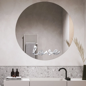 Macro detail of silver mirror 3D acrylic 'love' wall sticker in modern bathroom scene