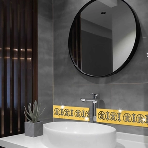 Close-up of bright yellow acrylic mirror wall stickers with black hollow floral patterns