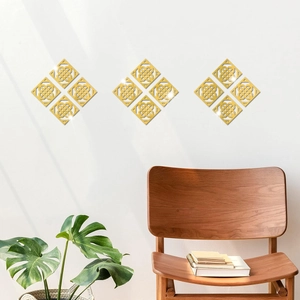 Detailed view of gold geometric hollow acrylic wall stickers on a modern white living room wall