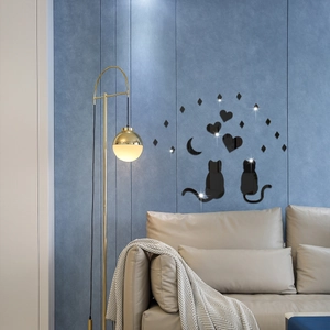 Detail of 3D mirror acrylic cat and moon wall stickers on a modern blue bedroom wall