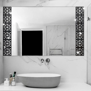 Detail of Chinese hollow geometric wall stickers on a modern bathroom mirror surface