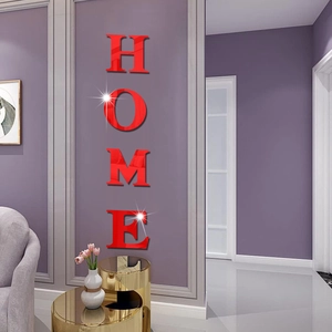 Detail of red acrylic 3D mirror HOME wall stickers on a modern living room wall decoration