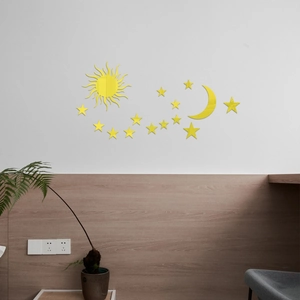 Detailed view of yellow moon and stars acrylic mirror wall stickers on a white wall