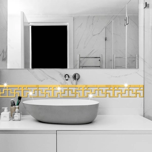 Detail of gold geometric hollow acrylic mirror wall sticker on marble bathroom tile