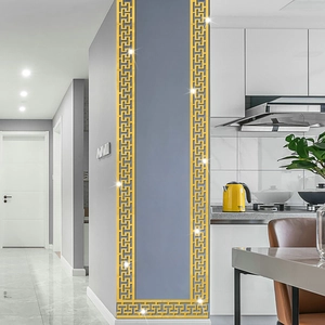 Macro shot of gold Greek Key pattern acrylic mirror border sticker on modern home wall