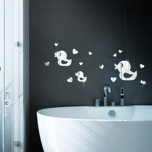 Detailed mirror-finish acrylic duck and heart wall stickers on a grey marble bathroom wall