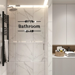 Modern 3D black acrylic bathroom sign with elegant scrolls on marble glass wall