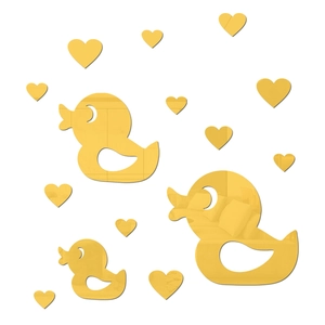 Macro detail of golden acrylic heart and duck mirror stickers with high reflective finish