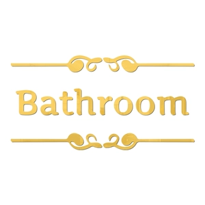 Detail of golden mirror bathroom sign with elegant European scroll patterns
