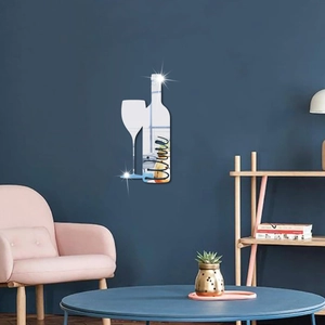 Close-up of silver acrylic mirror wall stickers featuring wine bottle and glass silhouettes