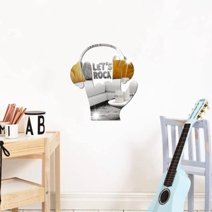 Detail of acrylic rock hand mirror sticker with headphones and Let's Rock text on white wall