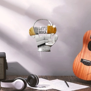 Macro shot of acrylic mirror wall art showing high-gloss reflection and 'Let's Rock' text