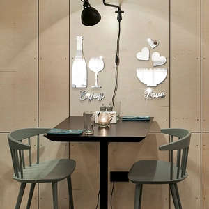 Detail of silver mirror acrylic wall stickers with Enjoy Love text and wine glass shapes