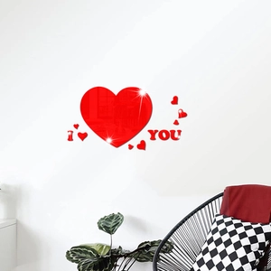 Red 3D mirror acrylic heart wall stickers with I Love You letters on a white wall