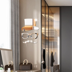 Close-up of creative acrylic mirror wall stickers featuring gentleman hat and glasses