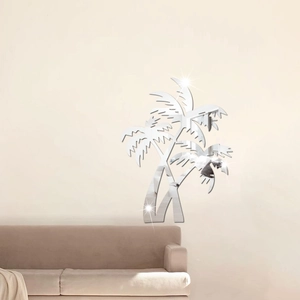Détail de stickers muraux miroir en forme de cocotiers décorant un salon moderne élégant