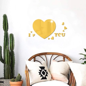Detail of 3D gold acrylic mirror heart wall stickers with I Love You lettering decor