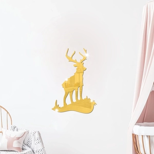 Detail of golden mirror acrylic deer wall sticker on a white living room wall decor