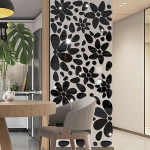Moderne schwarze Acryl-Wandaufkleber in Kieselform mit floralem Spiegel-Design-Dekor