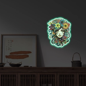 Art mural lumineux montrant un portrait floral avec un effet de néon vert brillant