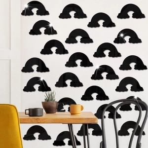 Detail of black acrylic rainbow mirror stickers arranged on a modern home living room wall