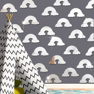 Detail view of reflective rainbow and cloud acrylic mirror wall stickers in a modern nursery