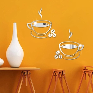 Close-up of silver acrylic coffee cup mirror wall stickers on a bright orange surface