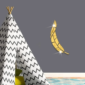 Macro detail of golden feather acrylic mirror wall stickers with elegant reflective finish