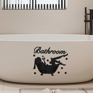 Mirror effect black bathroom wall sticker with silhouette and bubbles on a white bathtub