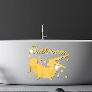Detail of golden acrylic mirror wall sticker with Bathroom lettering and figure on a bathtub