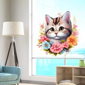 Close-up of cute cartoon cat wall sticker with colorful flowers on a bright window glass