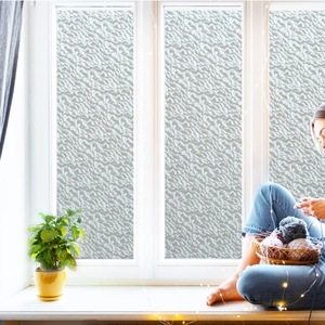 Detail of frosted window privacy film with textured embossed pattern for bright home decor