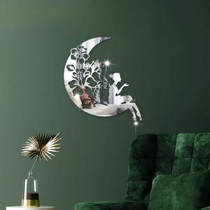 Detail showing acrylic mirror wall sticker with silver moon and fairy on dark green wall