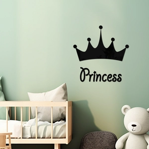 Detail of black acrylic crown and Princess wall sticker on a green kids bedroom wall