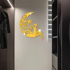 Detailed view of a golden acrylic mirror wall sticker featuring a moon and fairy silhouette