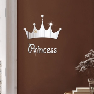 Detail of silver acrylic mirror wall sticker with crown and Princess text on brown wall