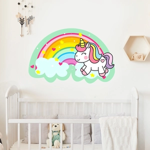 Nursery setting featuring unicorn, rainbow, and star luminous wall stickers on white wall