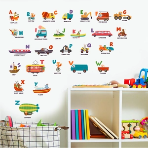 Detail of 26 alphabet wall decals with cartoon vehicles in a kid's educational playroom