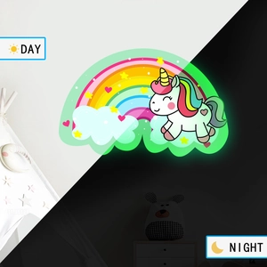 Luminous rainbow unicorn wall stickers showing day and night glowing effects in a bedroom