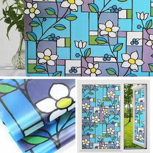 Frosted window film with white floral and blue geometric patterns for home privacy
