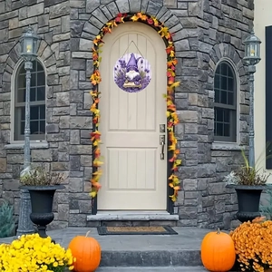 Lavender gnome round wooden sign hanging on a farmhouse front door with autumn decor