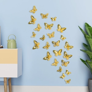 Detailed macro view of 3D gold hollow butterfly wall stickers with metallic texture for decor